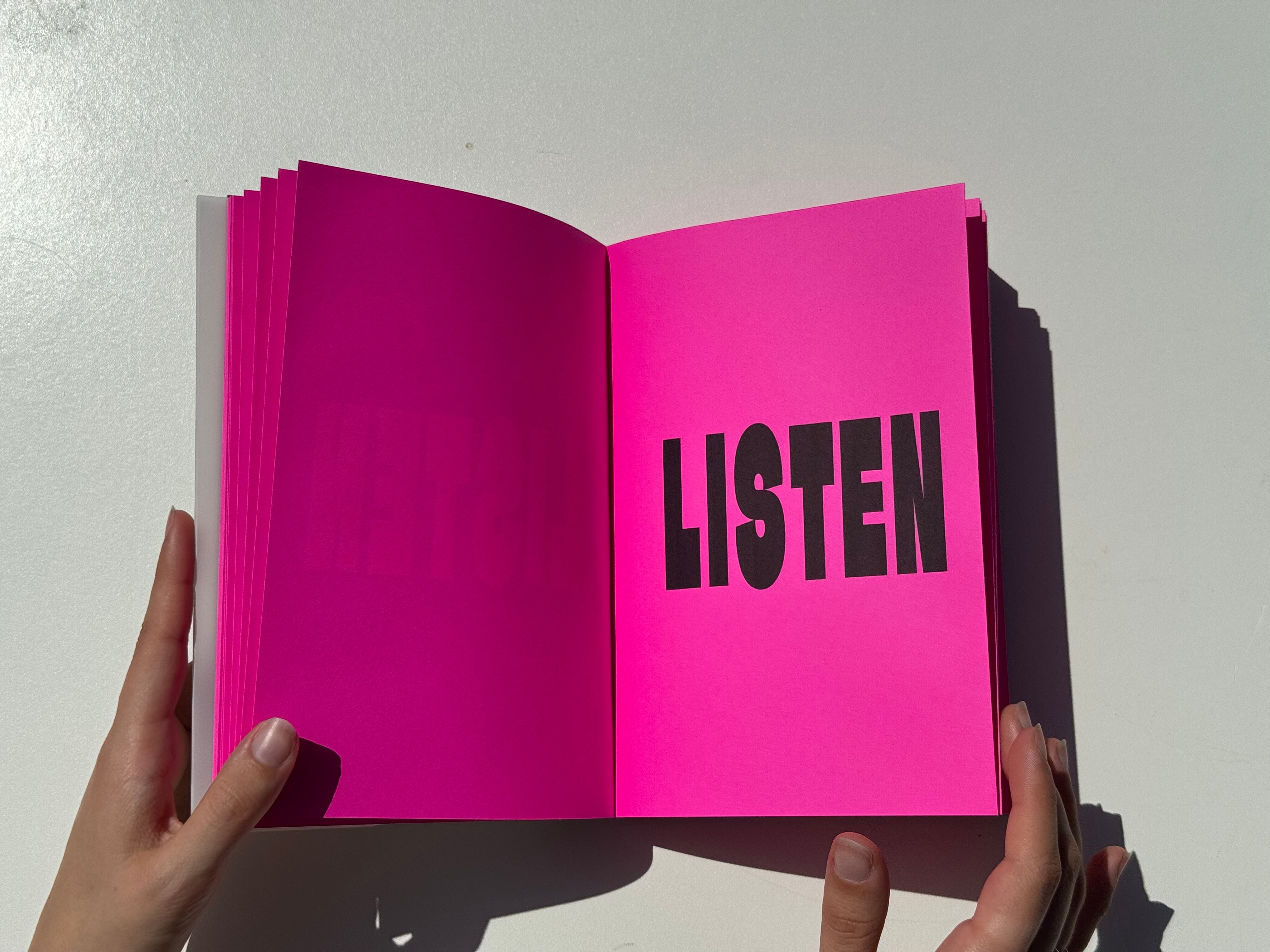 A white background with a sleeve of chocolate. The packaging of the chocolate is purple and black.